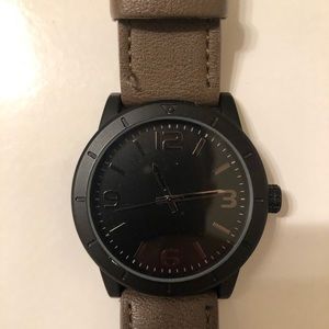 Black watch, light brown wristband